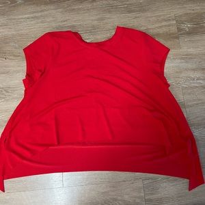 Free People Movement Red Top, slits at the bottom at both sides. Never worn